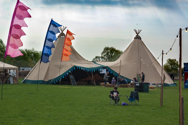 outside-teepee-with-coloured-flags